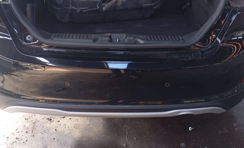 Rear bumper with sensor